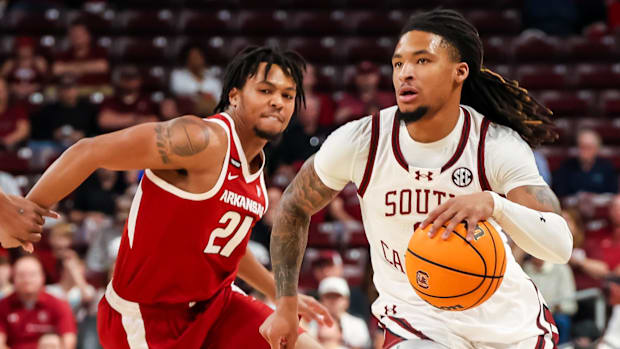 South Carolina Gamecocks guard Jamarii Thomas (6) drives past Arkansas Razorbacks guard D.J. Wagner (21)