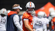 Auburn Tigers head coach Hugh Freeze talks with quarterback Jackson Arnold (11) during practice at Woltosz Football Performance Center in Auburn, Ala. on Thursday, Aug. 14, 2025.