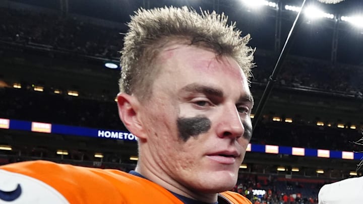 Dec 21, 2025; Denver, Colorado, USA; Denver Broncos quarterback Bo Nix (10) and Jacksonville Jaguars quarterback Trevor Lawrence (16) meet after the game at Empower Field at Mile High. Mandatory Credit: Ron Chenoy-Imagn Images