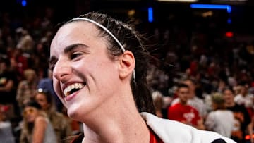 Indiana Fever star Caitlin Clark smiles after becoming the first rookie to achieve a triple-double, July 6, 2024.