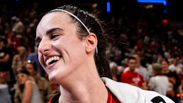 Indiana Fever guard Caitlin Clark (22) smiles in an interview after becoming the first rookie to achieve a triple-double Saturday, July 6, 2024, during the game at Gainbridge Fieldhouse in Indianapolis. The Fever defeated the Liberty, 83-78.