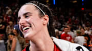 Indiana Fever guard Caitlin Clark smiles after becoming the first rookie to achieve a triple-double.