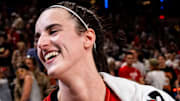 Indiana Fever guard Caitlin Clark smiles in an interview after becoming the first rookie to achieve a triple-double.