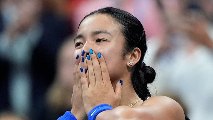 Alexandra Eala acknowledges the crowd