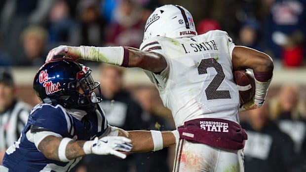 Mississippi State's safety Isaac Smith (2) runs the ball after intercepting it during the Egg Bowl game.