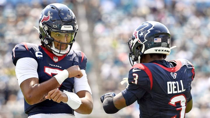 Sep 24, 2023; Jacksonville, Florida, USA; Houston Texans quarterback CJ Stroud (7) celebrates a touchdown with wide receiver Tank Dell (3) during the first half against the Jacksonville Jaguars at EverBank Stadium. Mandatory Credit: Melina Myers-USA TODAY Sports