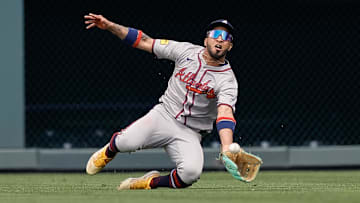 Apr 30, 2025; Denver, Colorado, USA; Atlanta Braves right field Eddie Rosario (9) makes a catch for an out in the third inning against the Colorado Rockies at Coors Field. Mandatory Credit: Isaiah J. Downing-Imagn Images