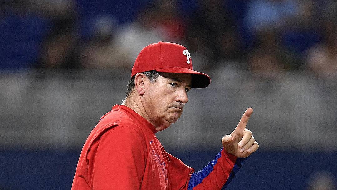 Jun 17, 2025; Miami, Florida, USA;  Philadelphia Phillies manager Rob Thomson signals for pitcher Tanner Banks during the 6th inning against the Miami Marlins at loanDepot Park