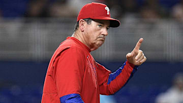 Jun 17, 2025; Miami, Florida, USA;  Philadelphia Phillies manager Rob Thomson signals for pitcher Tanner Banks during the 6th inning against the Miami Marlins at loanDepot Park