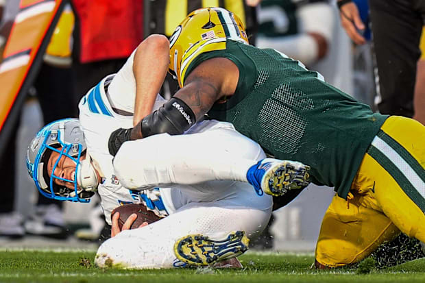 Detroit Lions quarterback Jared Goff (16) is sacked by Green Bay Packers defensive end Micah Parsons.