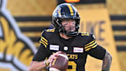Jun 16, 2024; Hamilton, Ontario, CAN; Hamilton Tiger Cats quarterback Bo Levi Mitchell carries the ball in the first quarter against the Saskatchewan Rough Riders at Tim Hortons Field. Mandatory Credit: Gerry Angus-Imagn Images