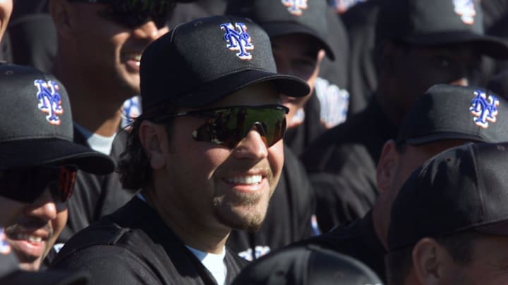Mets catcher Mike Piazza poses during a team photo before a game against the Florida Marlins in Port St. Lucie, Florida Tuesday March 6, 2001. Mets catcher Mike Piazza poses during a team photo before a game against the Florida Marlins in Port St. Lucie, Florida Tuesday March 6, 2001.
