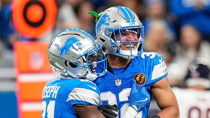 Detroit Lions safety Kerby Joseph (31), left, and safety Brian Branch (32) celebrate a play against Chicago Bears during the first half at Ford Field in Detroit on Thursday, Nov. 28, 2024.