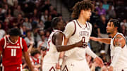 South Carolina Gamecocks guard Morris Ugusuk (15), forward Jordan Butler (0) and guard Jacobi Wright (1) celebrate a play against the Arkansas Razorbacks in the second half at Colonial Life Arena. 