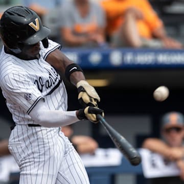 Vanderbilt Commodores' RJ Austin (42) hits the ball as Vanderbilt Commodores take on Tennessee Volunteer during the SEC baseball tournament at Hoover Met in Birmingham, Ala., on Saturday, May 24, 2025.