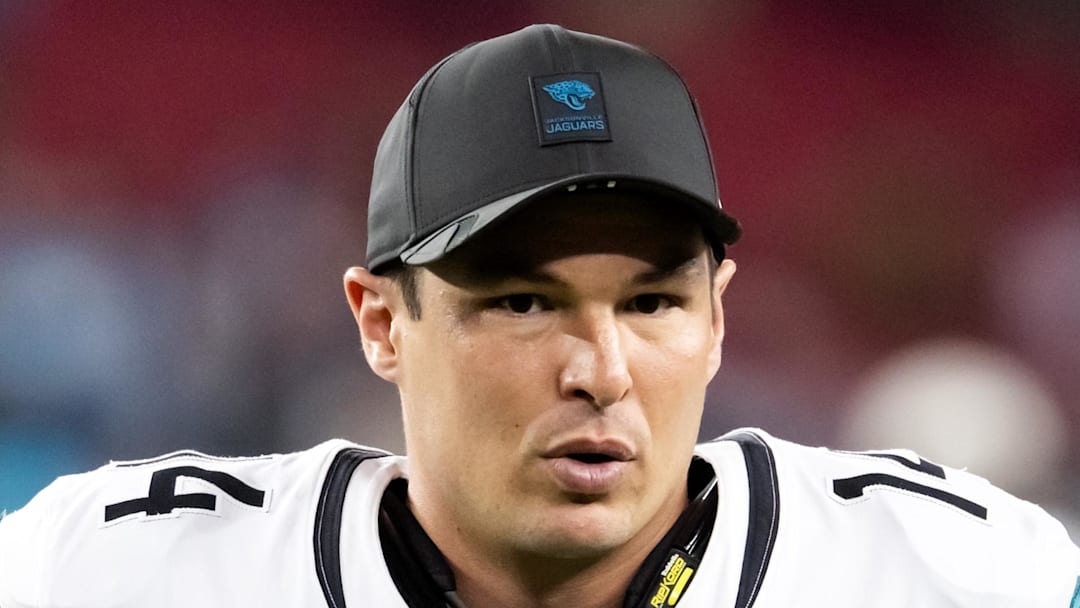 Nov 23, 2025; Glendale, Arizona, USA; Jacksonville Jaguars quarterback Nick Mullens (14) against the Arizona Cardinals at State Farm Stadium. Mandatory Credit: Mark J. Rebilas-Imagn Images