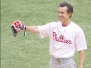 Actor Rob McElhenney prepares to throw the first pitch before the Philadelphia Phillies-New York Mets London game.
