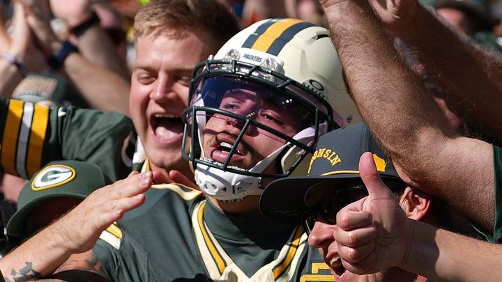 Week 5: Green Bay Packers wide receiver Christian Watson does a Lambeau Leap after scoring a touchdown against the Chicago Bears at Lambeau Field. The Packers defeated the Bears, 31-7.