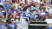 Bills wide receiver Tyrell Shavers goes up to get a pass across the middle during route drills.