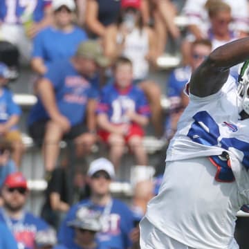 Bills wide receiver Tyrell Shavers goes up to get a pass across the middle during route drills.