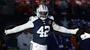 Dallas Cowboys defensive ends Jadeveon Clowney and Donovan Ezeiruaku celebrate after a play against the Kansas City Chiefs 