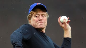 Movie actor Robert Redford throws out the ceremonial first pitch prior to a game between the Chicago Cubs and the Pittsburgh Pirates at Wrigley Field on April 1, 2011.