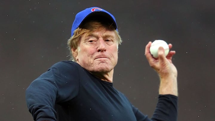 Movie actor Robert Redford throws out the ceremonial first pitch prior to a game between the Chicago Cubs and the Pittsburgh Pirates at Wrigley Field on April 1, 2011.