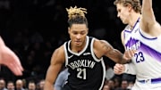 Dec 4, 2025; Brooklyn, New York, USA; Brooklyn Nets forward Noah Clowney (21) moves the ball past Utah Jazz forward Lauri Markkanen (23) during the first quarter at Barclays Center. Mandatory Credit: Tom Horak-Imagn Images