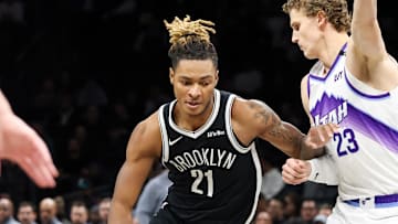 Dec 4, 2025; Brooklyn, New York, USA; Brooklyn Nets forward Noah Clowney (21) moves the ball past Utah Jazz forward Lauri Markkanen (23) during the first quarter at Barclays Center. Mandatory Credit: Tom Horak-Imagn Images