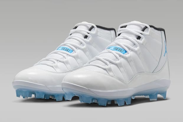 White and blue Air Jordan cleats.