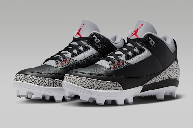 Black and grey Air Jordan cleats.