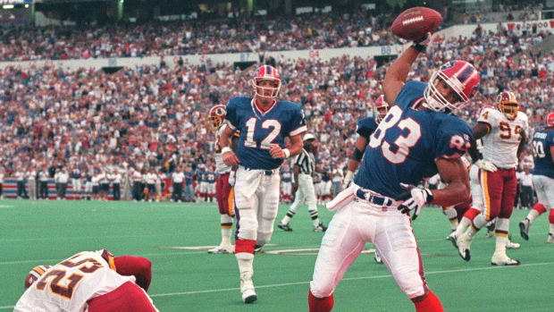 Andre Reed (83) and Jim Kelly have had their differences last season but they say its all behind