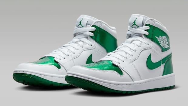 Green and white Air Jordan golf shoes.