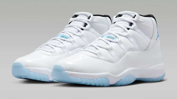 White and blue Air Jordan 11 sneakers.