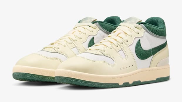 White and green Nike tennis shoes.