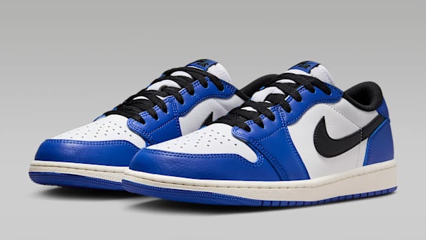 Blue, black, and white Air Jordan 1 Low sneakers.