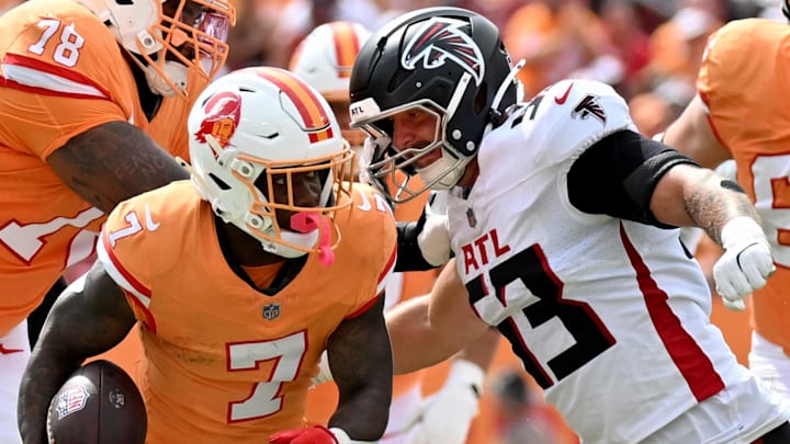 Oct 27, 2024; Tampa, Florida, USA; Atlanta Falcons linebacker Nate Landman (53) attempted to tackle Tampa Bay Buccaneers running back Bucky Irving (7) in the first quarter against the Atlanta Falcons at Raymond James Stadium. Mandatory Credit: Jonathan Dyer-Imagn Images Oct 27, 2024; Tampa, Florida, USA; Atlanta Falcons linebacker Nate Landman (53) attempted to tackle Tampa Bay Buccaneers running back Bucky Irving (7) in the first quarter against the Atlanta Falcons at Raymond James Stadium. Mandatory Credit: Jonathan Dyer-Imagn Images