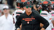 Oklahoma State interim football coach Doug Meacham walks the sideline in a Big 12 game against Texas Tech on Saturday, Oct. 25, 2025, at Jones AT&T Stadium.