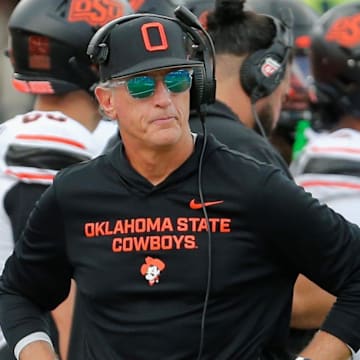 Oklahoma State interim football coach Doug Meacham walks the sideline in a Big 12 game against Texas Tech on Saturday, Oct. 25, 2025, at Jones AT&T Stadium.