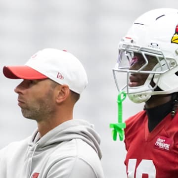 Jul 24, 2025; Glendale, AZ, USA; Arizona Cardinals head coach Jonathan Gannon (left) with wide receiver Marvin Harrison Jr. (18) during training camp at State Farm Stadium. Mandatory Credit: Mark J. Rebilas-Imagn Images