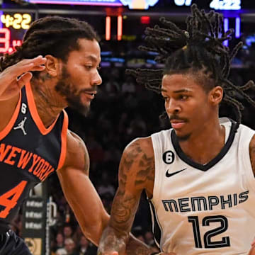 Nov 27, 2022; New York, New York, USA;  Memphis Grizzlies guard Ja Morant (12) drives to the basket on New York Knicks guard Derrick Rose (4) during the third quarter at Madison Square Garden. 