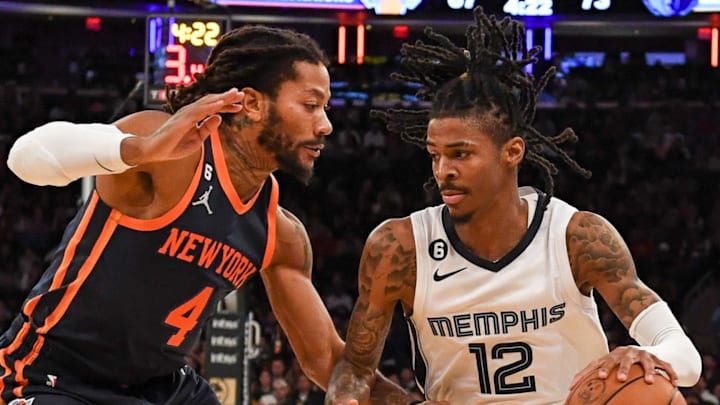 Nov 27, 2022; New York, New York, USA;  Memphis Grizzlies guard Ja Morant (12) drives to the basket on New York Knicks guard Derrick Rose (4) during the third quarter at Madison Square Garden. 