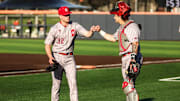 Indiana pitcher Cole Gilley and catcher Jake Stadler bump fists. Gilley's pitching effort helped the Hoosiers win Saturday's game against Illinois, but the Hoosiers were beaten in the other two games.