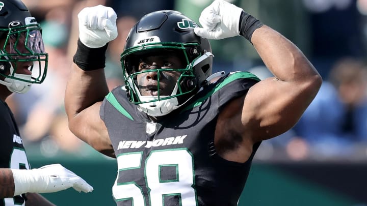 Oct 30, 2022; East Rutherford, New Jersey, USA; New York Jets defensive end Carl Lawson (58) reacts after a sack during the first quarter against the New England Patriots at MetLife Stadium. 