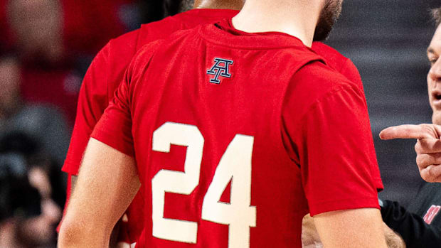 Nebraska Cornhuskers head coach Fred Hoiberg talks to guard Rollie Worster (24).