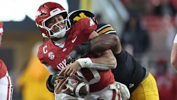 Nov 29, 2025; Fayetteville, Arkansas, USA; Arkansas Razorbacks quarterback Taylen Green (10) is sacked by Missouri Tigers defensive tackle Chris McClellan (7) during the fourth quarter at Donald W. Reynolds Razorback Stadium. Missouri won 31-17. Mandatory Credit: Nelson Chenault-Imagn Images