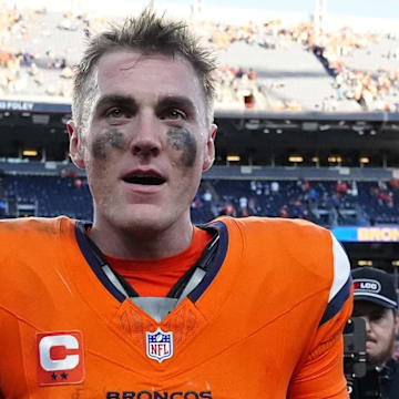 Oct 19, 2025; Denver, Colorado, USA; Denver Broncos quarterback Bo Nix (10) celebrates after the win against the New York Giants at Empower Field at Mile High. Mandatory Credit: Ron Chenoy-Imagn Images