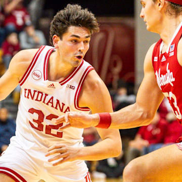 Indiana's Trey Galloway (32) drives on Nebraska's Josiah Allick (53) during the first half of the Indiana versus Nebraska men's basketball game at Simon Skjodt Assembly Hall on Wednesday, Feb. 21, 2024.