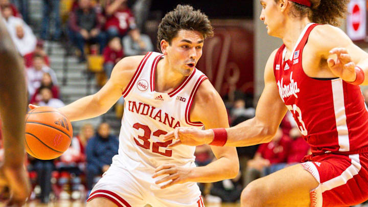 Indiana's Trey Galloway (32) drives on Nebraska's Josiah Allick (53) during the first half of the Indiana versus Nebraska men's basketball game at Simon Skjodt Assembly Hall on Wednesday, Feb. 21, 2024.