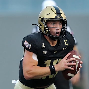 Aug 30, 2024; West Point, New York, USA; Army Black Knights quarterback Bryson Daily (13) carries the ball against the Lehigh Mountain Hawks during the first half at Michie Stadium. Mandatory Credit: Danny Wild-Imagn Images